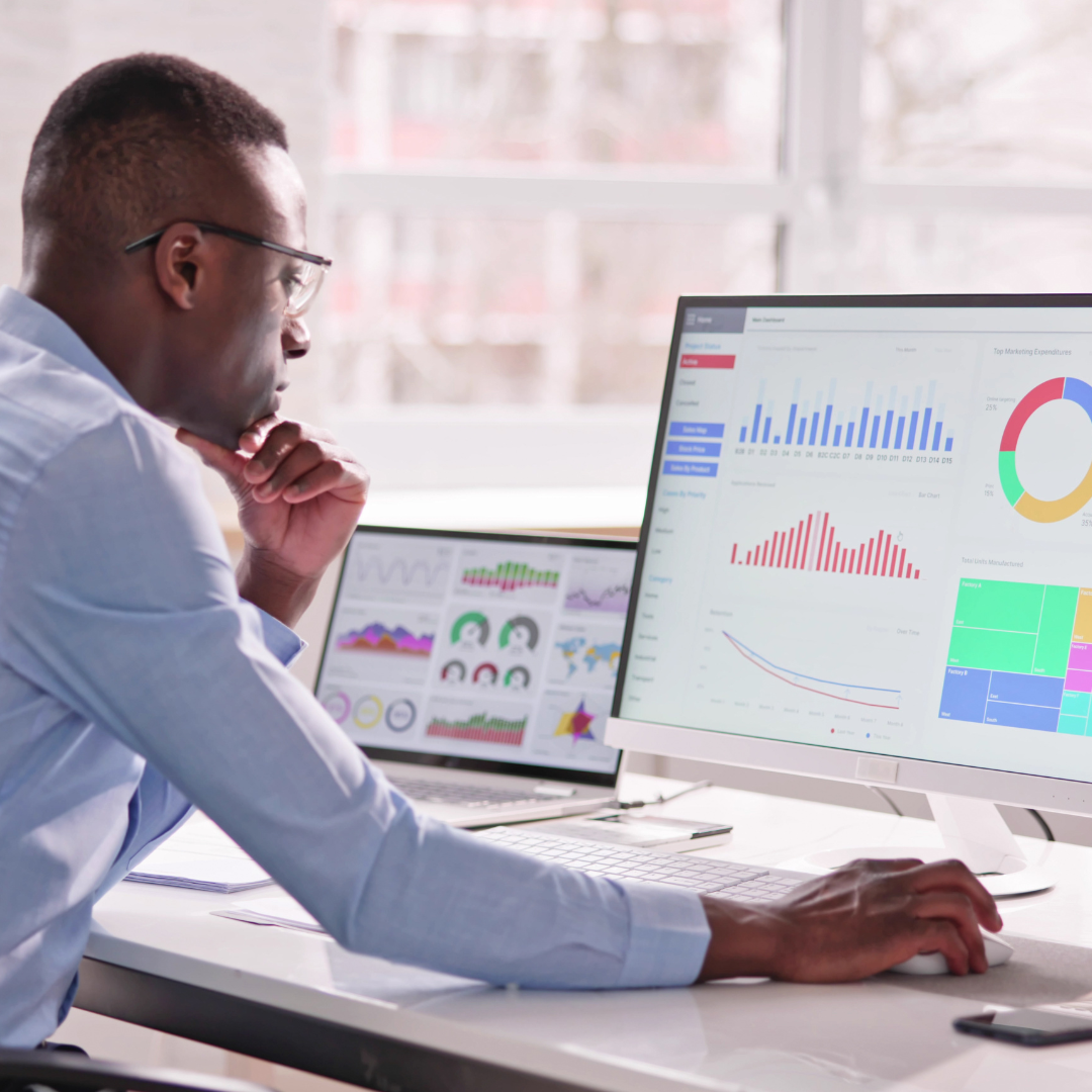 Colleague analysing implementation data